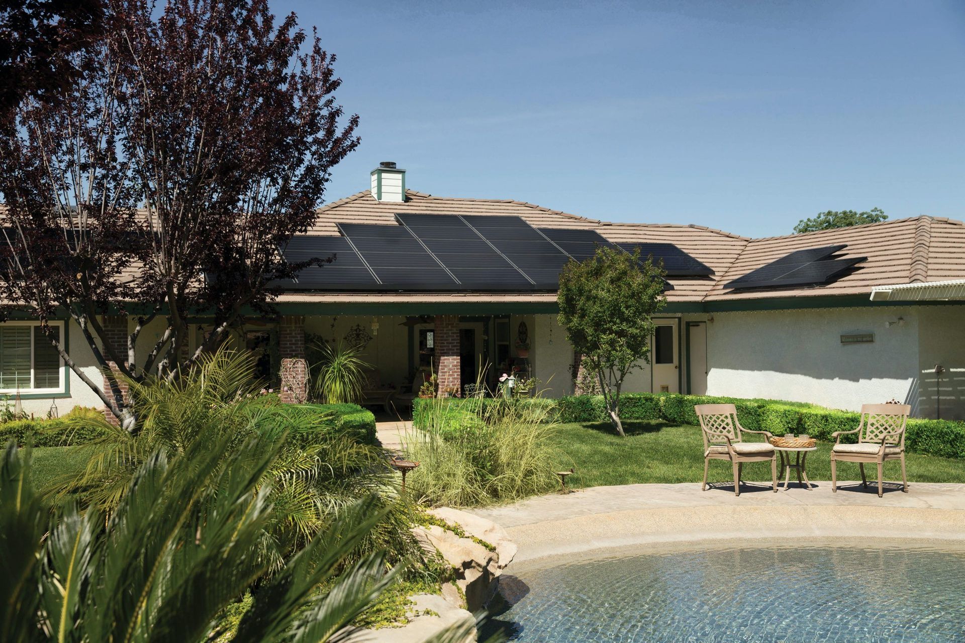 house with solar panels on the roof, generating solar power, installed by solar power installers near me.